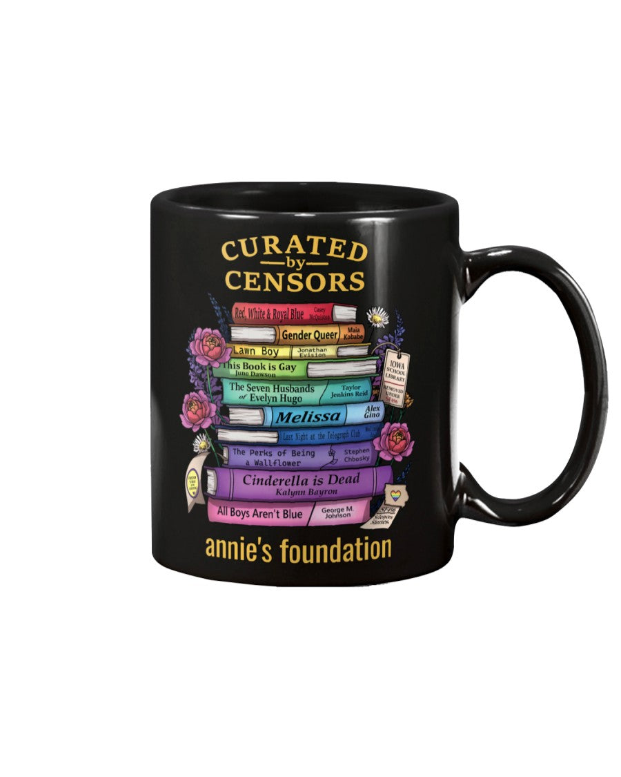 Annie's Foundation 15 oz black mug with Curated by Censors artwork featuring the titles of banned books