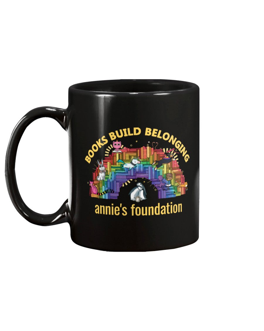 15 oz black mug featuring Books Build Belonging - Annie's Foundation pride collection