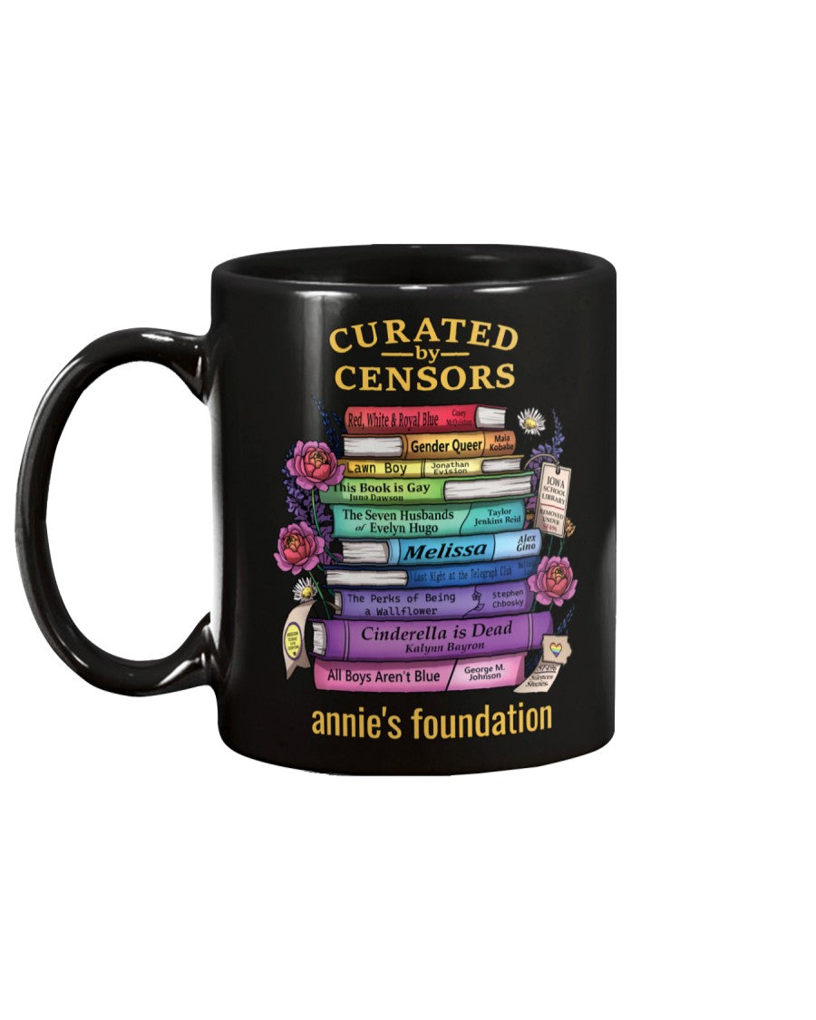 Annie's Foundation 15 oz black mug with Curated by Censors artwork featuring the titles of banned books