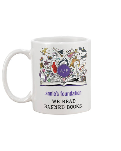 15 oz white ceramic mug with magical book artwork, Annie's Foundation logo and We Read Banned Books