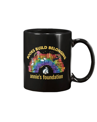 15 oz black mug featuring Books Build Belonging - Annie's Foundation pride collection